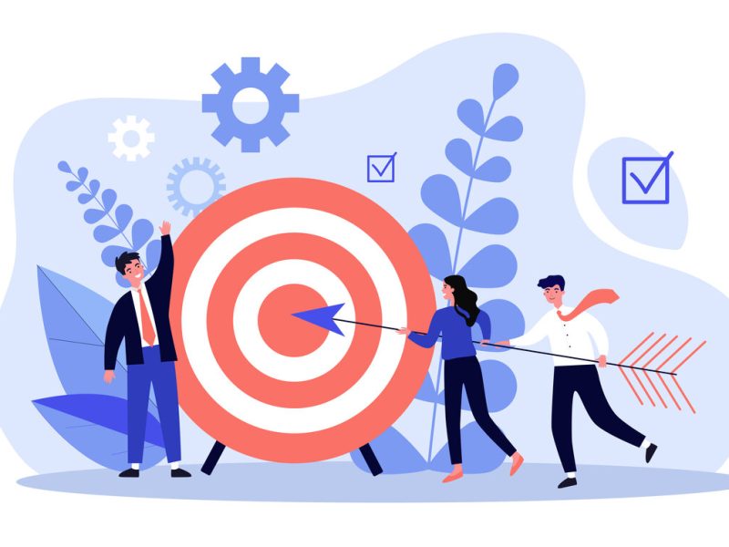 Businesspeople driving arrow to goal