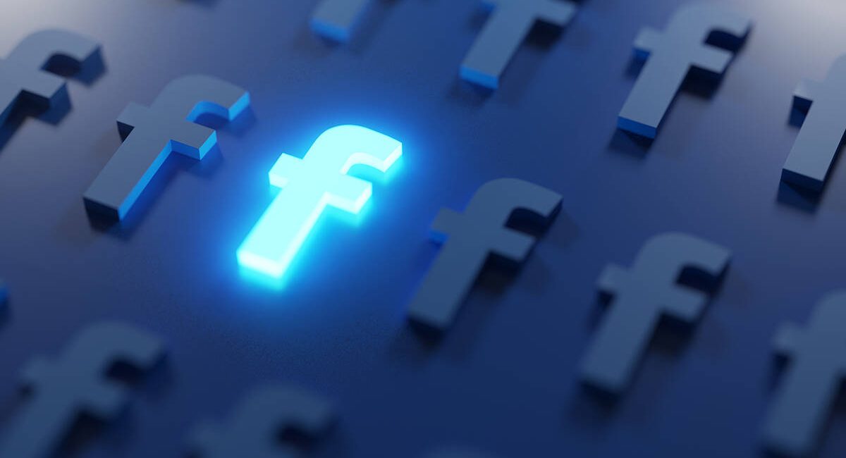 Stand Out on Social Media Concept. Glowing Facebook Logo